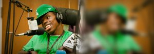 Young man with headphone talking in to a microphone