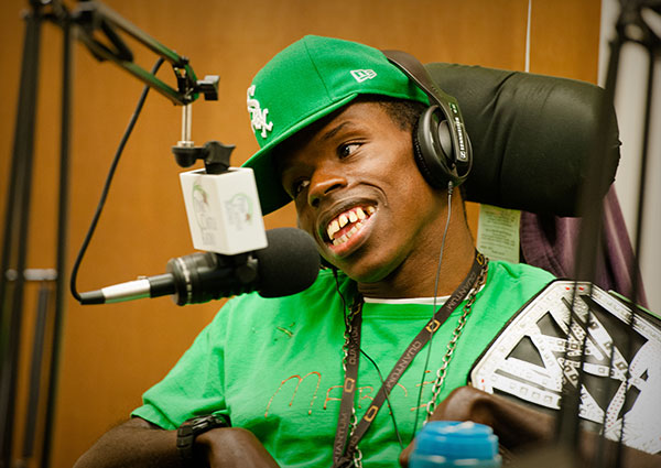 Young man with headphone talking in to a microphone