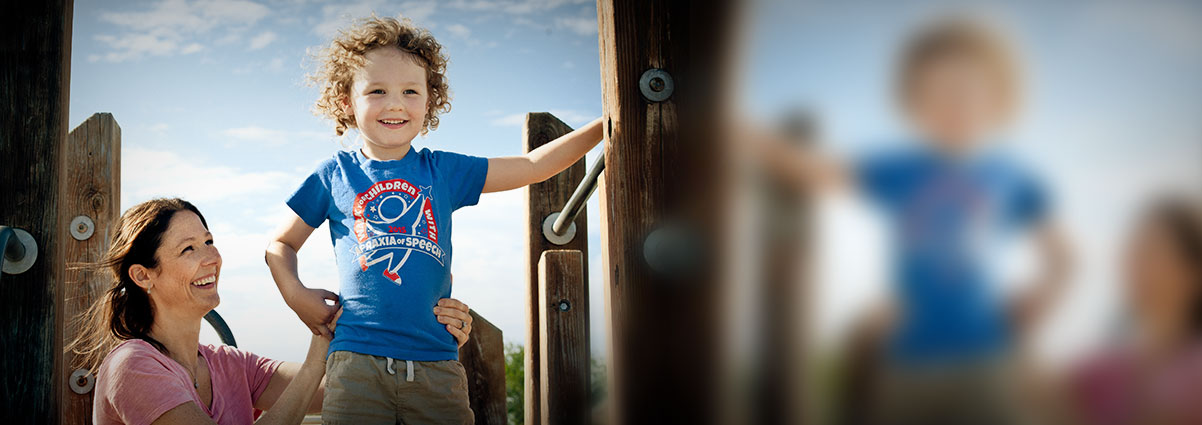 Kid standing on playground equipment