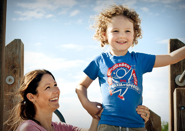 Kid standing on playground equipment