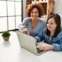 Mother and daughter looking at a computer