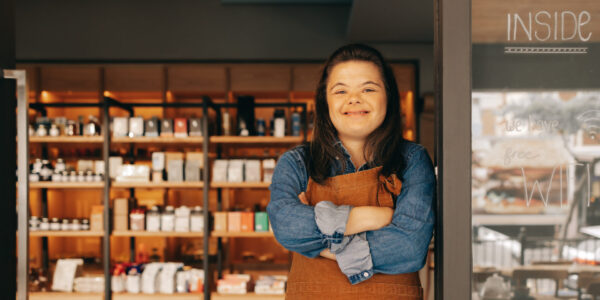 Working girl in front of her store