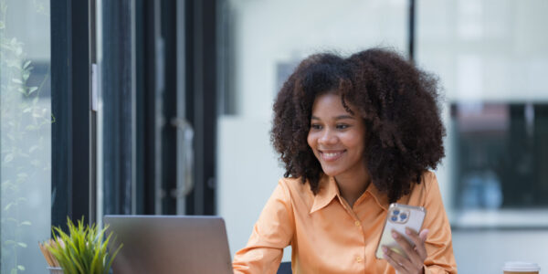 Woman on her computer and phone
