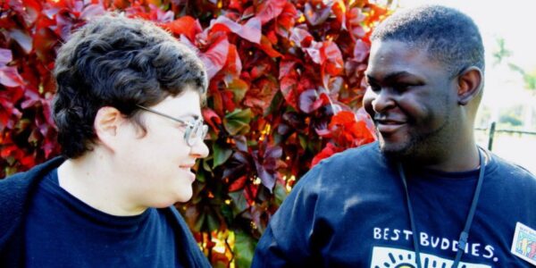 Two Best Buddies participants smiling together