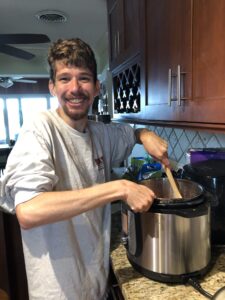 Elliot cooking in kitchen