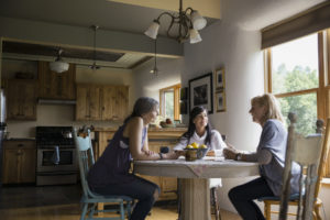 Families Gathered Around a Dining Room Table