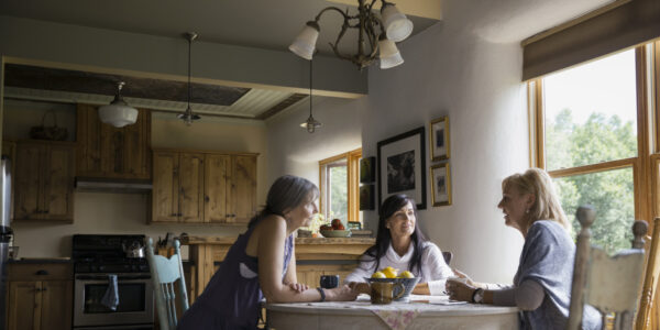 Families Gathered Around a Dining Room Table