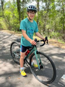 Caleb riding a bike