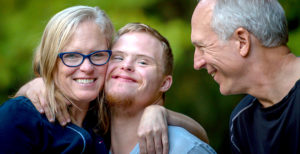 Family sharing a hug