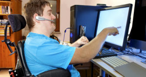 man using assistive technology for his computer