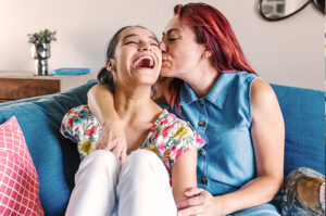 mom and daughter happy on couch