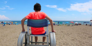 Boy in wheelchair enjoying the beach