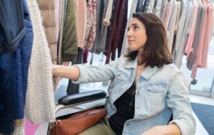 woman shopping for clothes in wheelchair